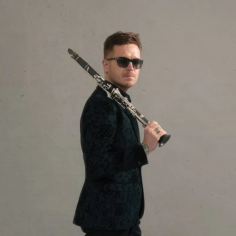 James Meldrum with clarinet over one shoulder