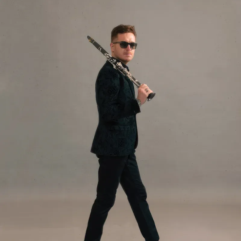 James Meldrum walking with his clarinet
